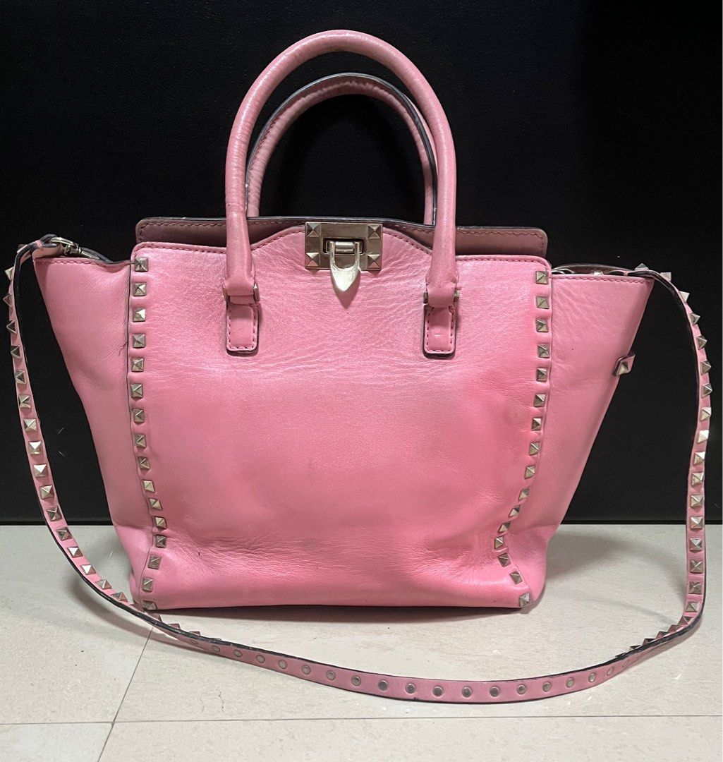 Valentino Rockstud Pink Handbag sling (Category: Luxury Bags & Wallets) located in Quezon City. Submitted by bebegaze (Listing ID 1384894934, Image 1). Description: Bawal sa maarte. With a lot of signs of use. Ukay source. Pls see all pics for details. Needs repaint. Coded. .