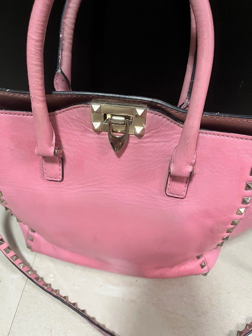 Valentino Rockstud Pink Handbag sling (Category: Luxury Bags & Wallets) located in Quezon City. Submitted by bebegaze (Listing ID 1384894934, Image 2). Description: Bawal sa maarte. With a lot of signs of use. Ukay source. Pls see all pics for details. Needs repaint. Coded. .