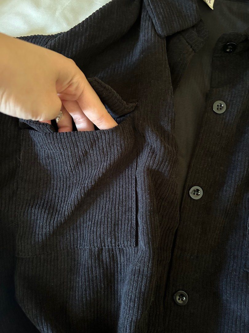 [3 FOR $5] Black Corduroy Overshirt Jacket - Size L (Category: Coats, Jackets and Outerwear) located in Singapore. Submitted by 4.44am (Listing ID 1380488801, Image 3). Description: Stylish black corduroy overshirt jacket. Features a classic button-down design with two front pockets. Perfect for layering or wearing on its own. Great condition, ready to wear! Ribbed material Barely worn Fits S-M, oversized.