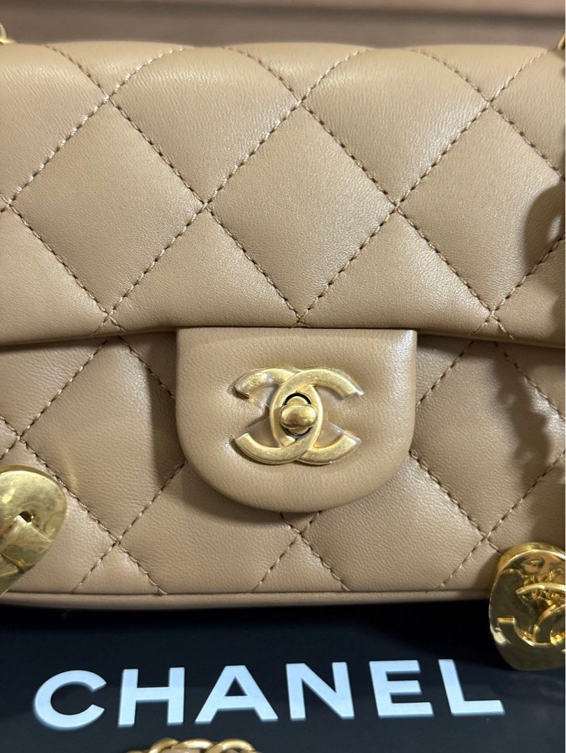 Chanel Mini Rectangle Flap Lambskin Beige (Category: Luxury Bags & Wallets) located in Manila. Submitted by ccluxuryy (Listing ID 1385197476, Image 3). Description: Chanel Mini Rec Heart Charms Flap in Caramel / Nude GHW Lambskin Leather Microchipped Excellent condition, no rubs, plastic film still intact Comes full box with gift receipt Retails for P360k 🥺 P240k only Location: Merville, Paranaque Meet up: MOA, DLSU, Newport, Greenbelt, BGC Deli