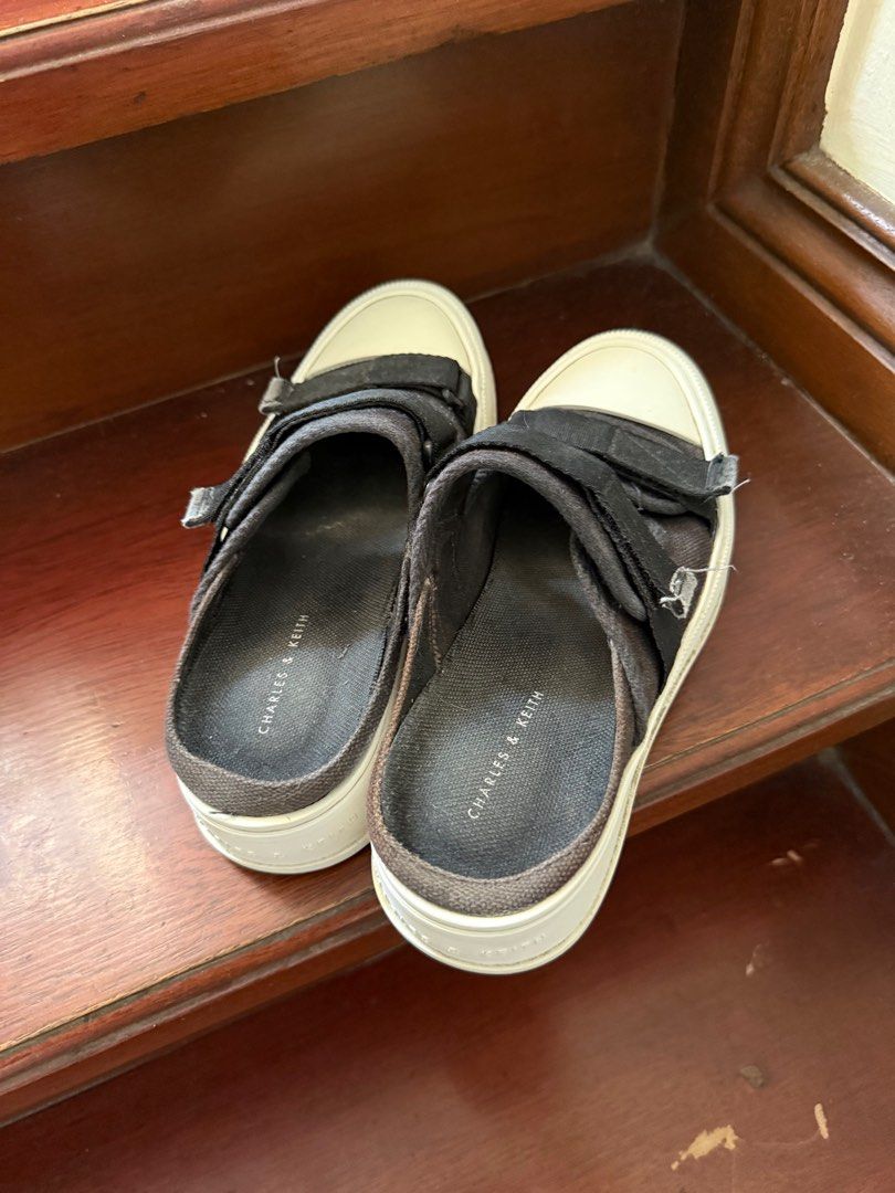 Charles and Keith Black Canvas Mules Sneakers (Category: Sneakers) located in San Pedro. Submitted by krisdl11 (Listing ID 1385056485, Image 3). Description: Needs a bit of cleaning but in excellent condition! Out of stock on the website. RFS super cute but too small.