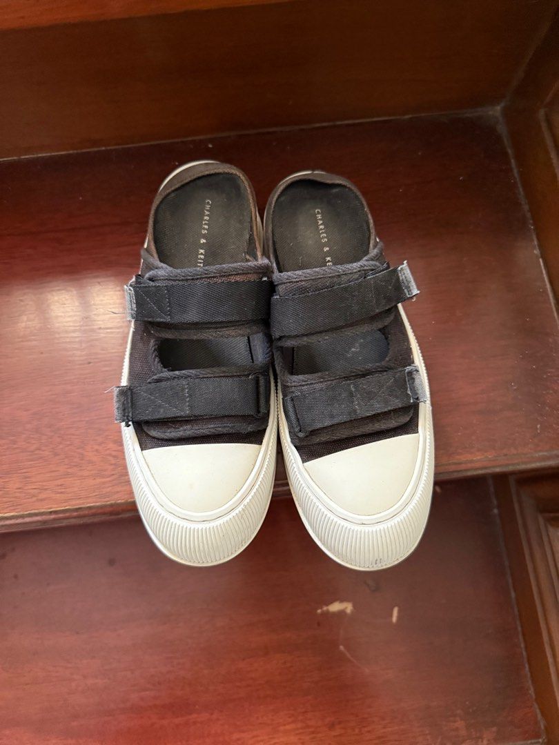 Charles and Keith Black Canvas Mules Sneakers (Category: Sneakers) located in San Pedro. Submitted by krisdl11 (Listing ID 1385056485, Image 2). Description: Needs a bit of cleaning but in excellent condition! Out of stock on the website. RFS super cute but too small.