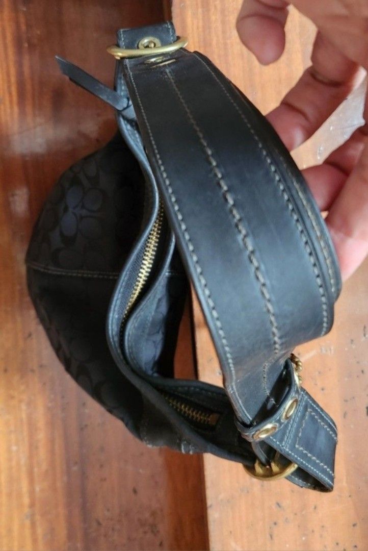 Coach Bleeker bag (Category: Luxury Bags & Wallets) located in Caloocan City. Submitted by geminimomma2 (Listing ID 1385055489, Image 3). Description: This is a medium-sized bucket/duffel bag w/ the monogram C pattern. Good for daily use. Fabric: Jacquard Finish: Matte Enclosure: Zip Incl: Bag charm; thick adjustable strap Dimensions : H-10in w/o strap, W-11in Serial: J076811487 Issue: Minor discoloration on leather Price is negotiable..