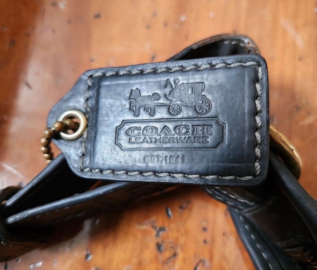 Coach Bleeker bag (Category: Luxury Bags & Wallets) located in Caloocan City. Submitted by geminimomma2 (Listing ID 1385055489, Image 2). Description: This is a medium-sized bucket/duffel bag w/ the monogram C pattern. Good for daily use. Fabric: Jacquard Finish: Matte Enclosure: Zip Incl: Bag charm; thick adjustable strap Dimensions : H-10in w/o strap, W-11in Serial: J076811487 Issue: Minor discoloration on leather Price is negotiable..