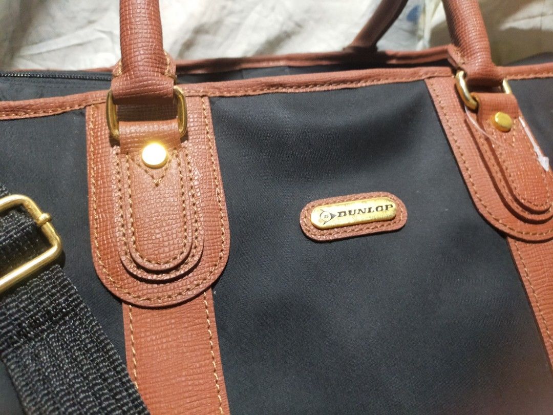 Dunlop traveling bag (Category: Luxury Bags & Wallets) located in Pasay City. Submitted by 22aileen (Listing ID 1385144395, Image 2). Description: Dunlop black nylon travel bag with unique ball rubber lining and handle.