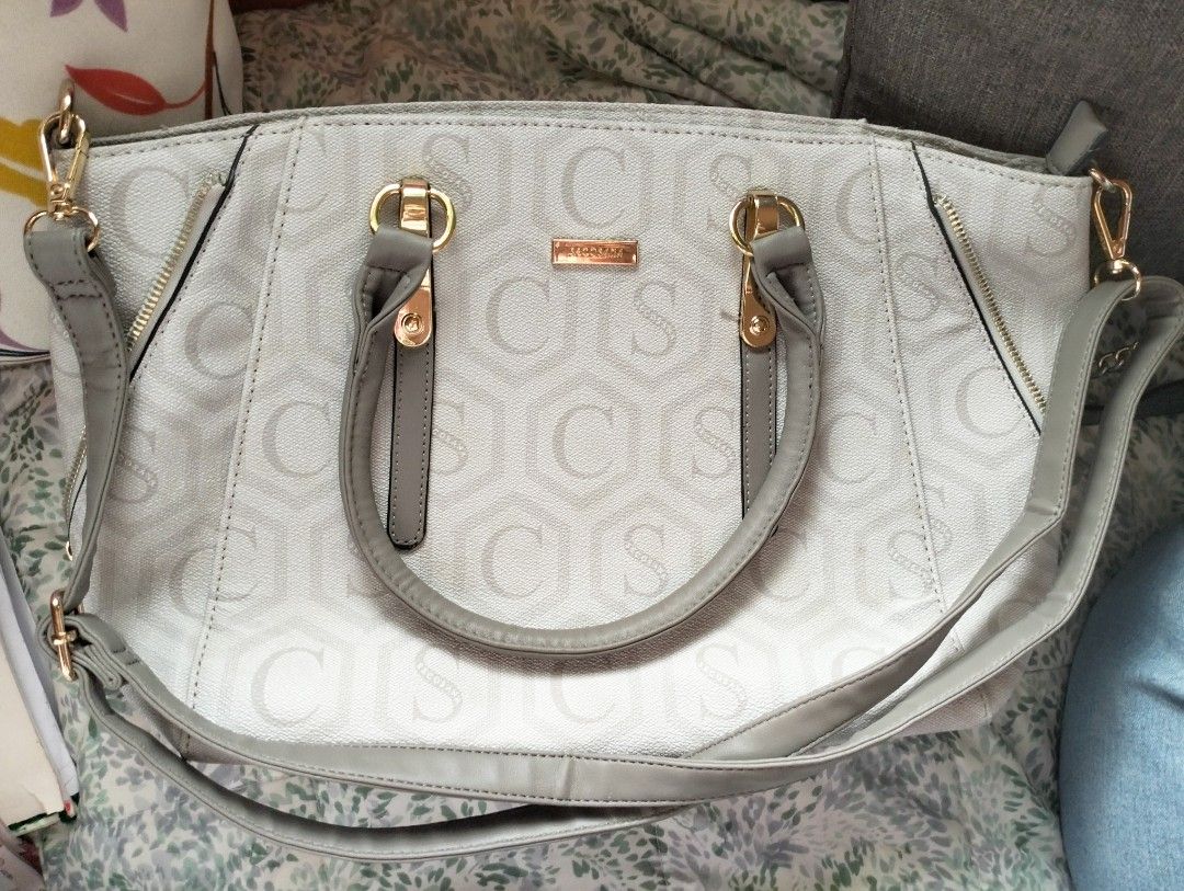 SECOSANA Shannon Printed Convertible Shoulder Bag (Category: Shoulder Bags) located in Caloocan City. Submitted by luvyanna (Listing ID 1385111545, Image 1). Description: Dimensions: Length: 39 cm Diameter: 44 cm Height: 25.5 cm Weight: 0.5 kg - Top zip main compartment closure. - Adjustable and detachable sling strap. - Branded metal logo inside. - Double top handles. - Gold-toned metal hardwares. - Metal feet. -Structured construction. - Exteri