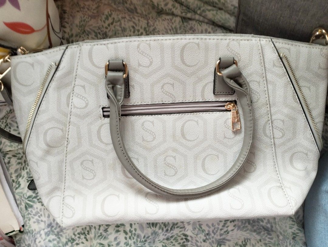 SECOSANA Shannon Printed Convertible Shoulder Bag (Category: Shoulder Bags) located in Caloocan City. Submitted by luvyanna (Listing ID 1385111545, Image 2). Description: Dimensions: Length: 39 cm Diameter: 44 cm Height: 25.5 cm Weight: 0.5 kg - Top zip main compartment closure. - Adjustable and detachable sling strap. - Branded metal logo inside. - Double top handles. - Gold-toned metal hardwares. - Metal feet. -Structured construction. - Exteri