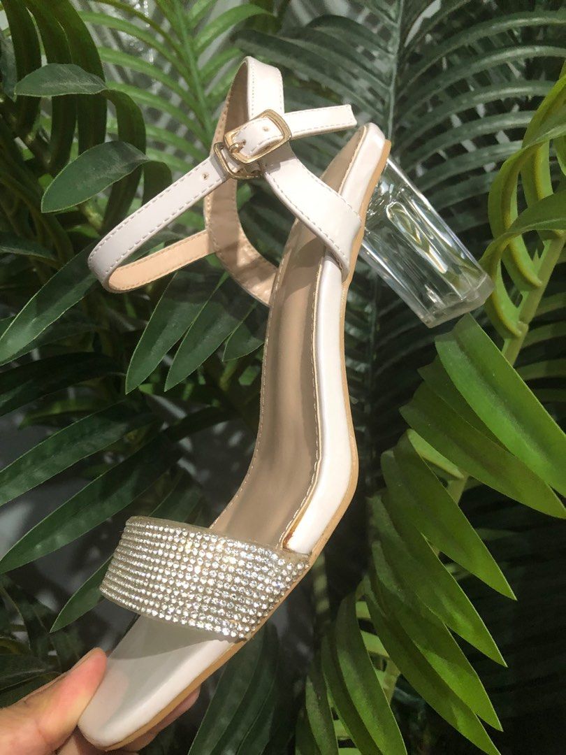 SUKI Rhinestone Clear Heeled Ankle Strap Sandals (Category: Heels) located in Caloocan City. Submitted by annacruzita (Listing ID 1385179391, Image 2). Description: Used as Bridal Shoes Size 38 Heel Height: 2 inches Rfs: Decluttering.
