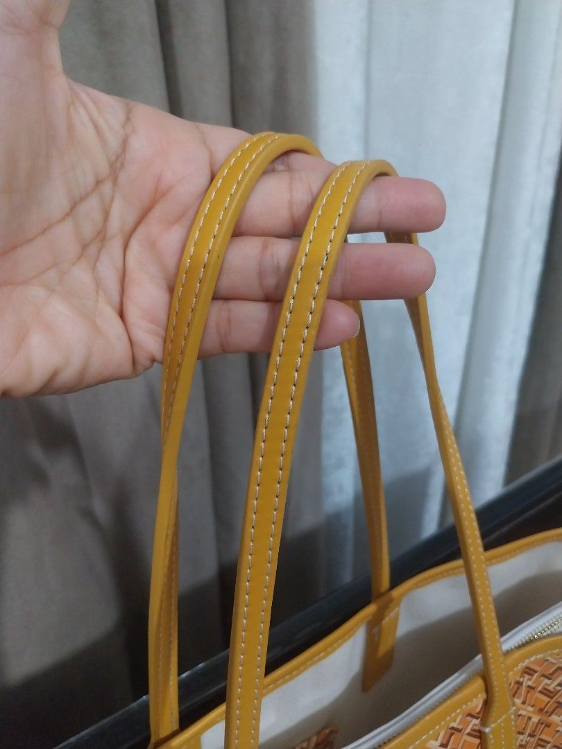 TOMMY H . - Tote Bag (Category: Tote Bags) located in Quezon City. Submitted by jonvee2000 (Listing ID 1385186037, Image 3). Description: Like new with detachable big pouch for safety no any issues Combination of brown & yellow in color.