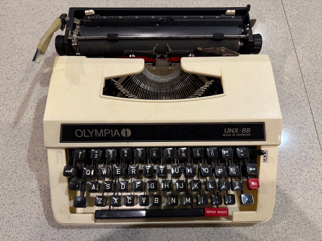 Vintage Olympia Typewriter (Category: Office & Business Technology) located in Quezon City. Submitted by almamercedes (Listing ID 1385202097, Image 1). Description: Olympia UNX-88 is a portable manual typewriter, produced in the 1970s. It was designed for home or small office use and is known for being compact and relatively lightweight. Made in Germany. Olympia was a respected German manufacturer known for producing reliable and well-built typew
