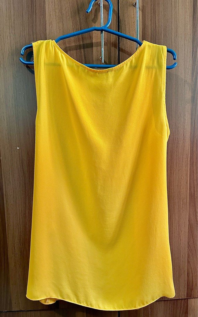 Zara Yellow Blouse/ Top (Category: Blouses) located in Manila. Submitted by jpclassics (Listing ID 1385103045, Image 3). Description: Zara Yellow Sleeveless Blouse Good as New Worn twice Size: Medium No when worn photo Color may vary due to lighting Last price posted RFS: Decluttering.