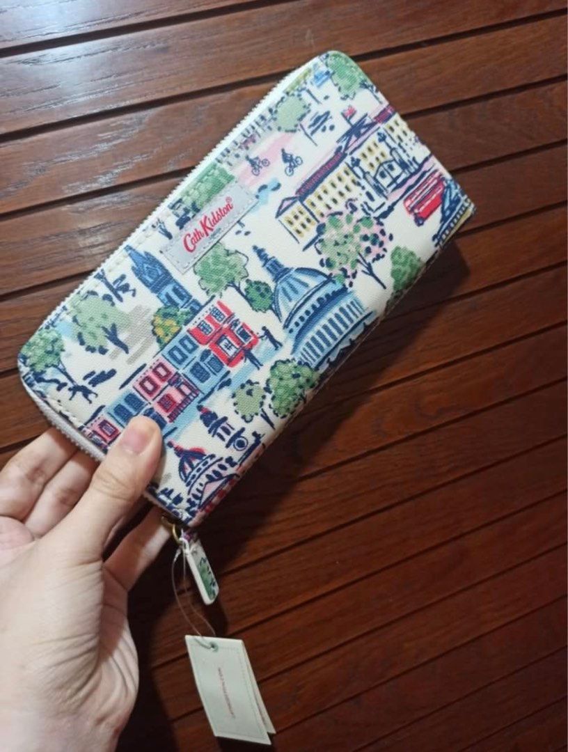 Authentic Cath Kidston Long Wallet, Mini London Continental View (Category: Wallets & Card holders) located in Quezon City. Submitted by MGcollection (Listing ID 1385300579, Image 2). Description: Original 💯 Cath Kidston Brand New with tag Unused, stored only in cabinet Out of stock on Cath Kidston website and stores 100% PVC Coated Pure Cotton (Outer) Pure Cotton (Inner).