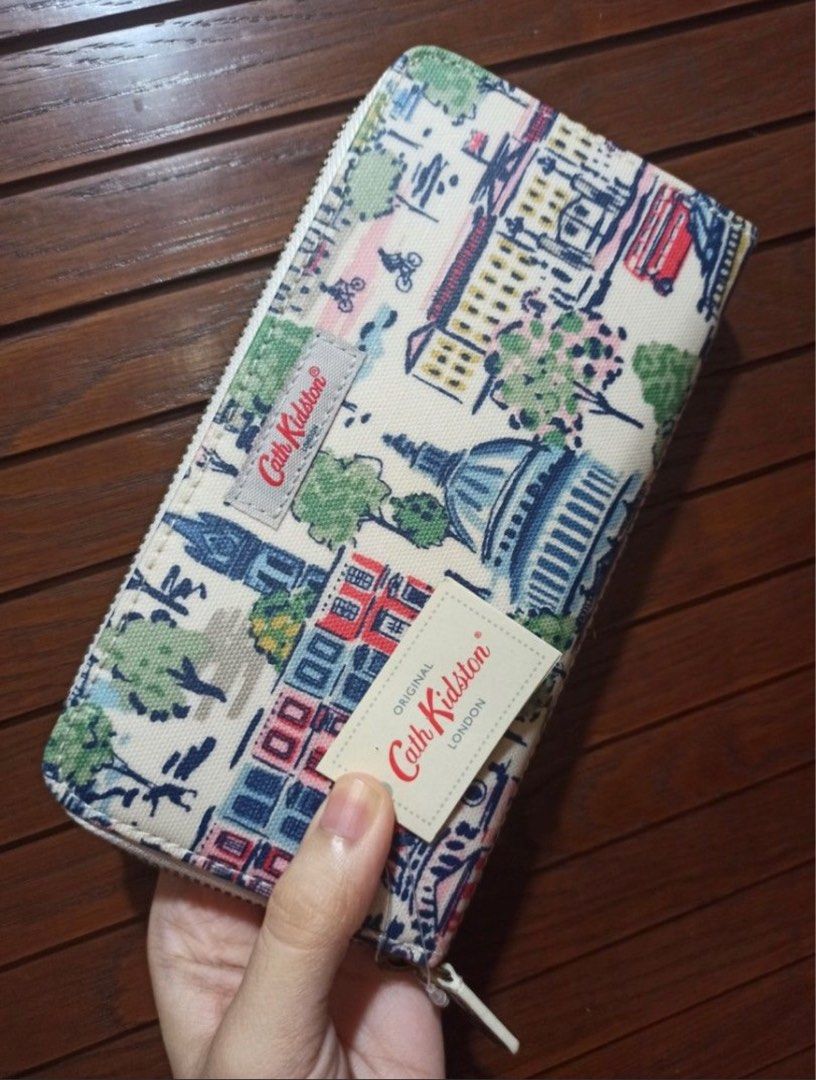 Authentic Cath Kidston Long Wallet, Mini London Continental View (Category: Wallets & Card holders) located in Quezon City. Submitted by MGcollection (Listing ID 1385300579, Image 1). Description: Original 💯 Cath Kidston Brand New with tag Unused, stored only in cabinet Out of stock on Cath Kidston website and stores 100% PVC Coated Pure Cotton (Outer) Pure Cotton (Inner).
