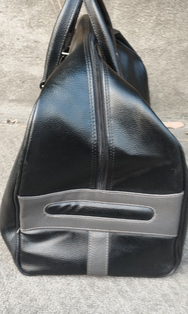 Black leather BMW traveling bag (Category: Luxury Bags & Wallets) located in Malabon City. Submitted by immortalpicker (Listing ID 1385240430, Image 2). Description: Black leather BMW traveling bag Brand= BMW NO to COD NO swapping Estimate size H= 13 inches L= 18 1/2 Inches W= 10 1/2 inches Color = black Material = synthetic leather Weight= 1.5 kg from Japan 2nd hand with scratch No warranty If there's Damage or Issues they can be seen in the las