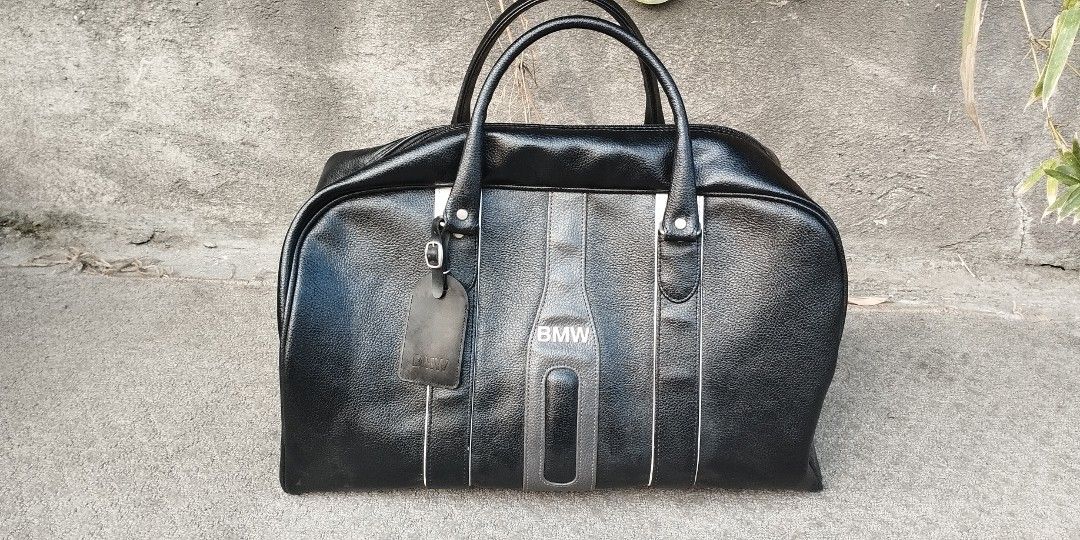 Black leather BMW traveling bag (Category: Luxury Bags & Wallets) located in Malabon City. Submitted by immortalpicker (Listing ID 1385240430, Image 1). Description: Black leather BMW traveling bag Brand= BMW NO to COD NO swapping Estimate size H= 13 inches L= 18 1/2 Inches W= 10 1/2 inches Color = black Material = synthetic leather Weight= 1.5 kg from Japan 2nd hand with scratch No warranty If there's Damage or Issues they can be seen in the las