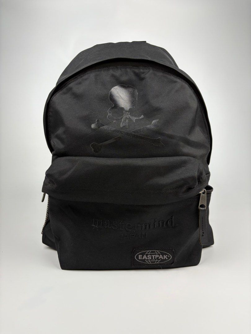 Mastermind x Eastpak Backpack (Category: Backpacks) located in Manila. Submitted by sc_rcity (Listing ID 1385426082, Image 2). Description: Technical canvas backpack in black. Tonal webbing carry handle at top. Twin adjustable padded shoulder straps. Tonal bonded logo, tonal embroidered logo, tonal textile logo patch, and zippered pocket at face. Zippered pocket at side. Tonal textile logo patch at back face. Two-way zip closure at main compartme