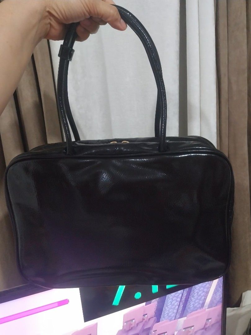 MIU Tote Bag (Category: Tote Bags) located in Quezon City. Submitted by jonvee2000 (Listing ID 1385296386, Image 3). Description: Almost new Beau Tote Bag Patent Leather/gold hardware Made in italy with white tag riri zip/satin cloth/leather (inside) w/ dustbag.