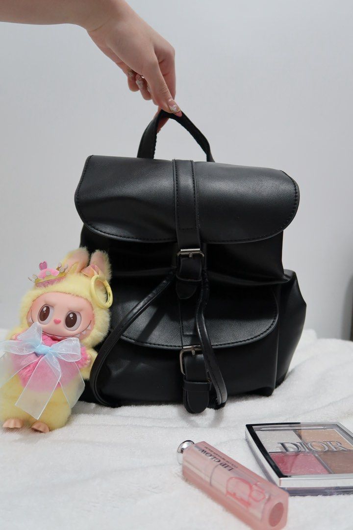 Small Backpack Bag in Black (Category: Backpacks) located in Manila. Submitted by maviii21 (Listing ID 1385423250, Image 1). Description: Hi! First-time seller here on Carousell 😊 These bags are from my personal collection — as someone who shops a lot, I’ve ended up with super mega daming bagss hahah! So it’s time for me to declutter. And not a scammer, promise! We can even do a video call if you want to be sure. About this bag: Bought this kasi