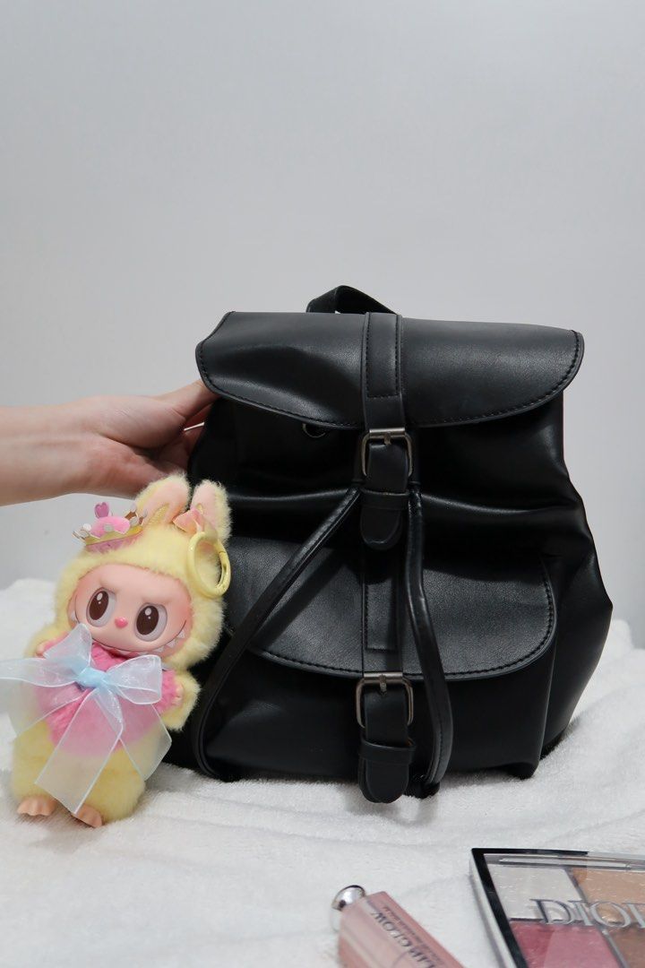 Small Backpack Bag in Black (Category: Backpacks) located in Manila. Submitted by maviii21 (Listing ID 1385423250, Image 2). Description: Hi! First-time seller here on Carousell 😊 These bags are from my personal collection — as someone who shops a lot, I’ve ended up with super mega daming bagss hahah! So it’s time for me to declutter. And not a scammer, promise! We can even do a video call if you want to be sure. About this bag: Bought this kasi