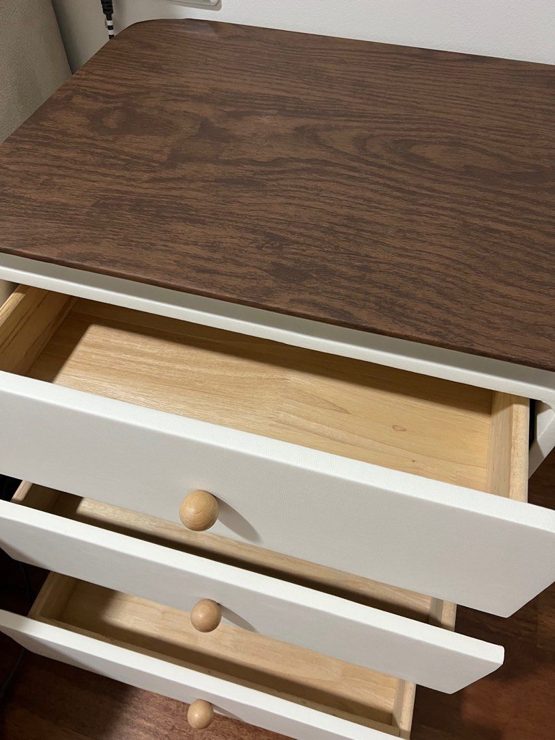 Bedside table (Category: Shelves, Cabinets & Racks) located in Kuala Lumpur. Submitted by mabkittie (Listing ID 1385593230, Image 2). Description: Bedside table - 3 drawers White colour with wooden top Size 50x40x58 cm Brand new with very small dent at the side I have 2 units for sale (price stated is for 1 unit).