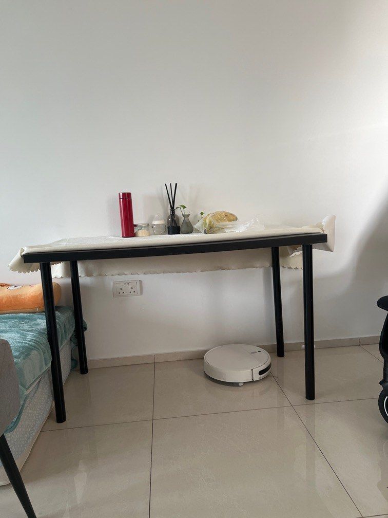 Black Rectangular Table (Category: Tables & Sets) located in Singapore. Submitted by love2nature (Listing ID 1379939690, Image 3). Description: This is a black rectangular table. It looks to be in great condition, legs can dismental. The table has a simple design, with a black tabletop and black legs. It would be perfect for a small apartment or a home office. It's a versatile piece of furniture that can be used for a variety of purposes, such as