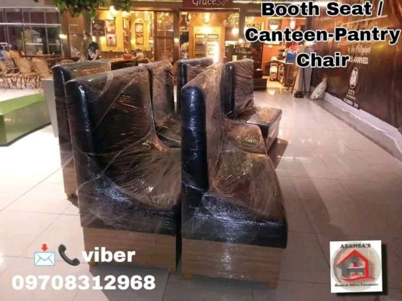 booth seat /pantry chair (Category: Other Home Furniture) located in Quezon City. Submitted by asanzasmik45405 (Listing ID 1385434069, Image 2). Description: A booth seat is a type of semi-private, built-in or freestanding seating unit, often found in restaurants, cafes, and other hospitality venues, that combines two or more banquette-style benches and a table to create an intimate, enclosed "room within a room" for diners. Booths can be straigh