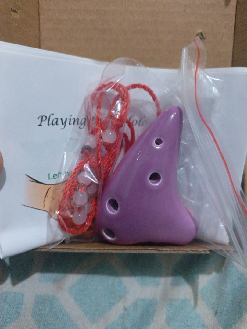 Ceramic Ocarina - Made in China (Category: Musical Instruments) located in Muntinlupa City. Submitted by kittymeowcute (Listing ID 1385574744, Image 2). Description: 6 Hole Ceramic Ocarina, pwedeng necklace, brand new pa. Supposed gift sa pamangkin but they don't know how to use it. 170 each. 300 nalang kung kukunin pareho.