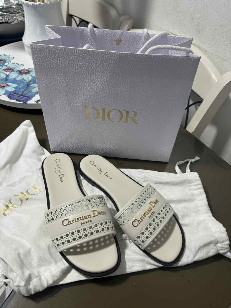 Dior D-Lane Slide (Category: Flats & Sandals) located in Quezon City. Submitted by jayzz1 (Listing ID 1385498333, Image 1). Description: - Lightly used -Guaranteed Original. Moneyback if proven fake. - Size 8 W - Purchased in Solaire - With dustbag - No box PM for more pics :) 📍Quezon City.