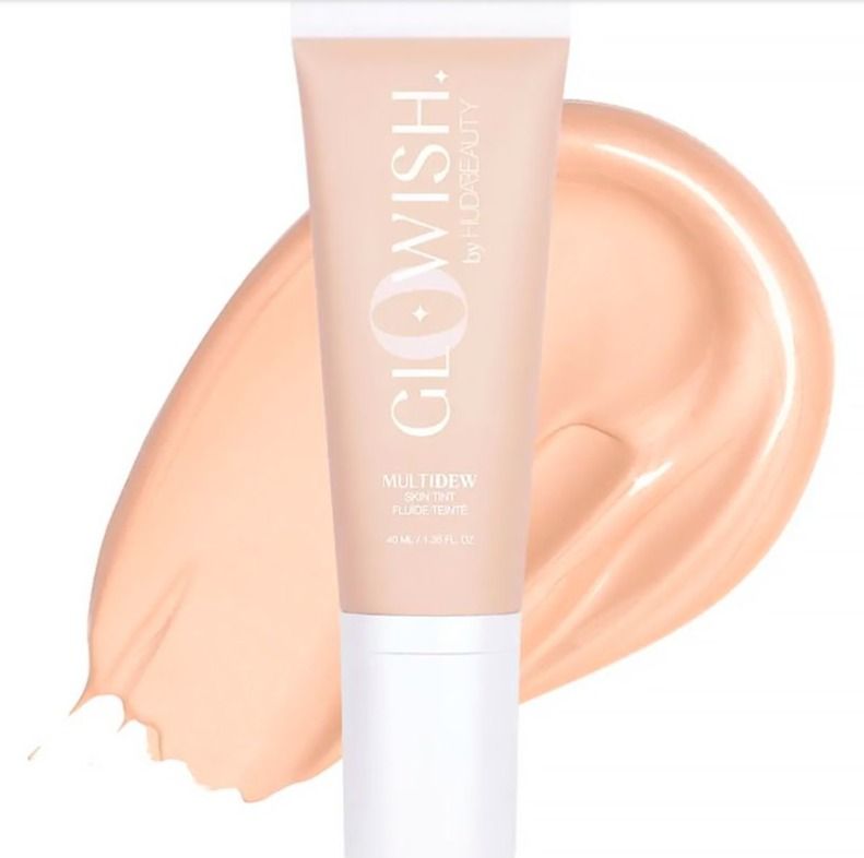 Huda Glowish Multidew Skin Tint (Category: Makeup) located in Manila. Submitted by memorylanestore (Listing ID 1385491233, Image 2). Description: Dewy, Second-Skin Vibes GloWish Multidew Skin Tint is a radiant, moisture-packed skin tint that instantly brightens your complexion and blurs pores for a soft-focus, dewy finish! Perfect for the ultimate “no makeup” makeup look, the sheer coverage illuminates your complexion (without hiding it!) and the