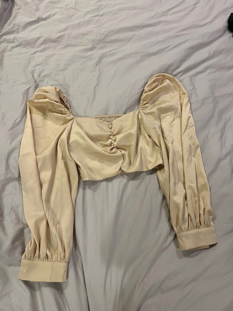 Satin Cropped Cream Longsleeves Blouss (Category: Blouses) located in Paranaque City. Submitted by vjau_ (Listing ID 1385540005, Image 1). Description: Fits small Super nice in actual.