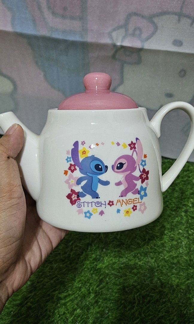 Stitch & angel ceramic tea pot (Category: Coffee & Tea Tableware) located in Umingan. Submitted by liezelsona48963 (Listing ID 1385450791, Image 3). Description: disney ceramics tea pot 4 inches mop gcash.