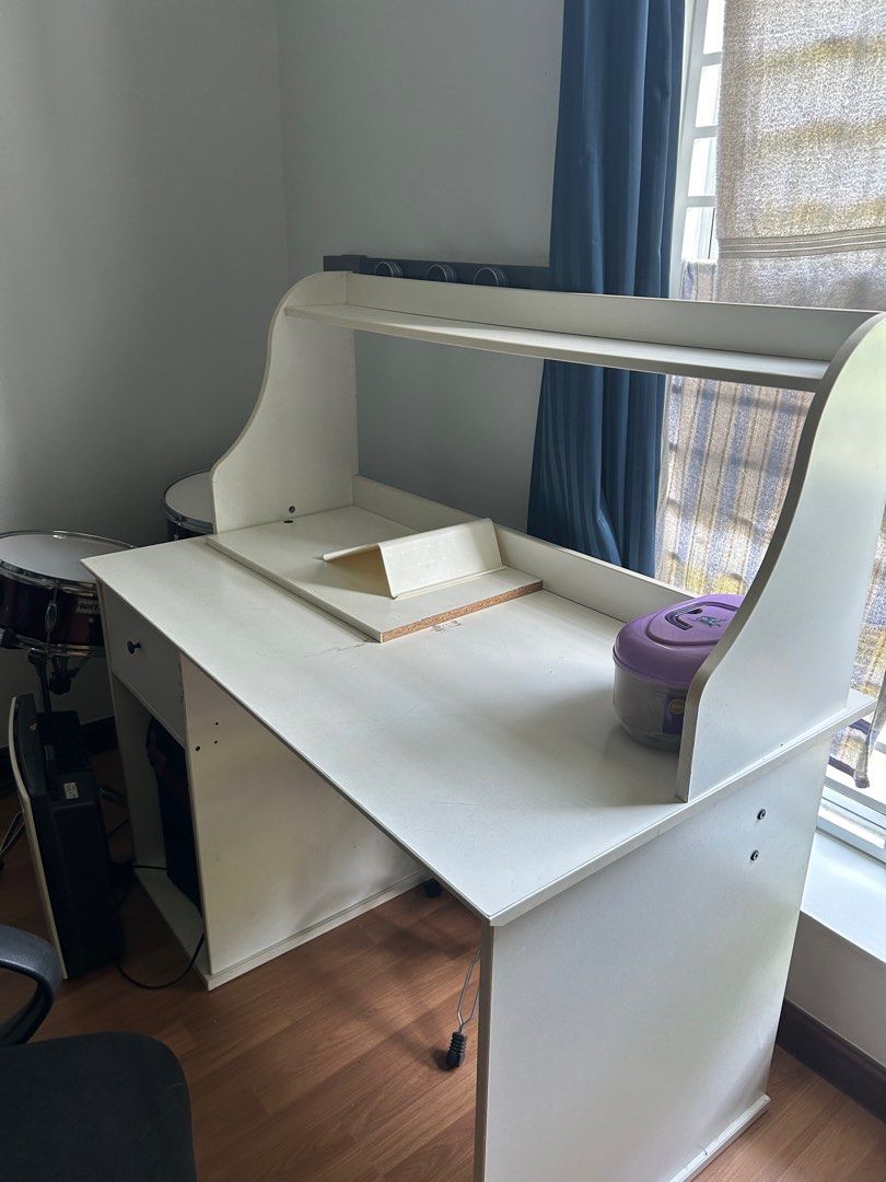 Study table (Category: Other Home Furniture) located in Subang Jaya. Submitted by chrisblack124 (Listing ID 1385462517, Image 1). Description: Lightly used white study/work desk with hutch and drawer, already dismantled for easy transport. Selling for RM50 (nego). Good condition with minor wear. Please arrange your own delivery — self-collection only..