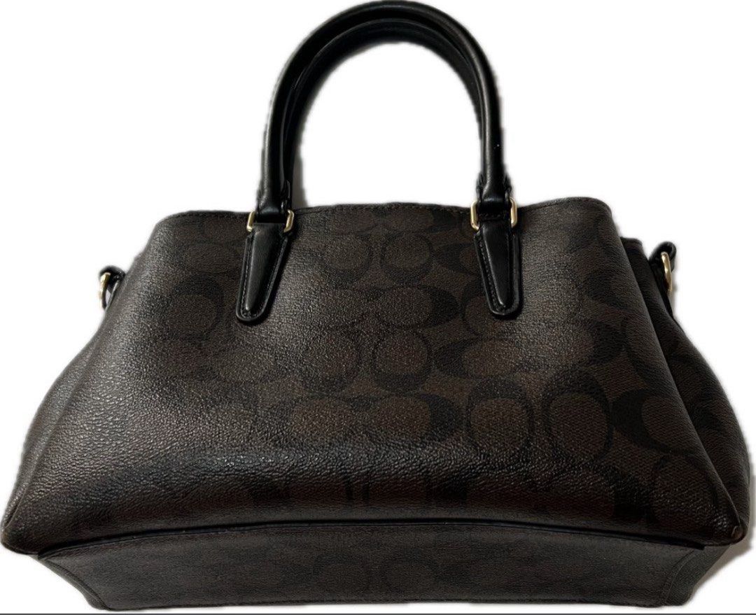 Authentic Coach black/brown mini caryall (Category: Luxury Bags & Wallets) located in Makati City. Submitted by gedjie (Listing ID 1385618881, Image 2). Description: .