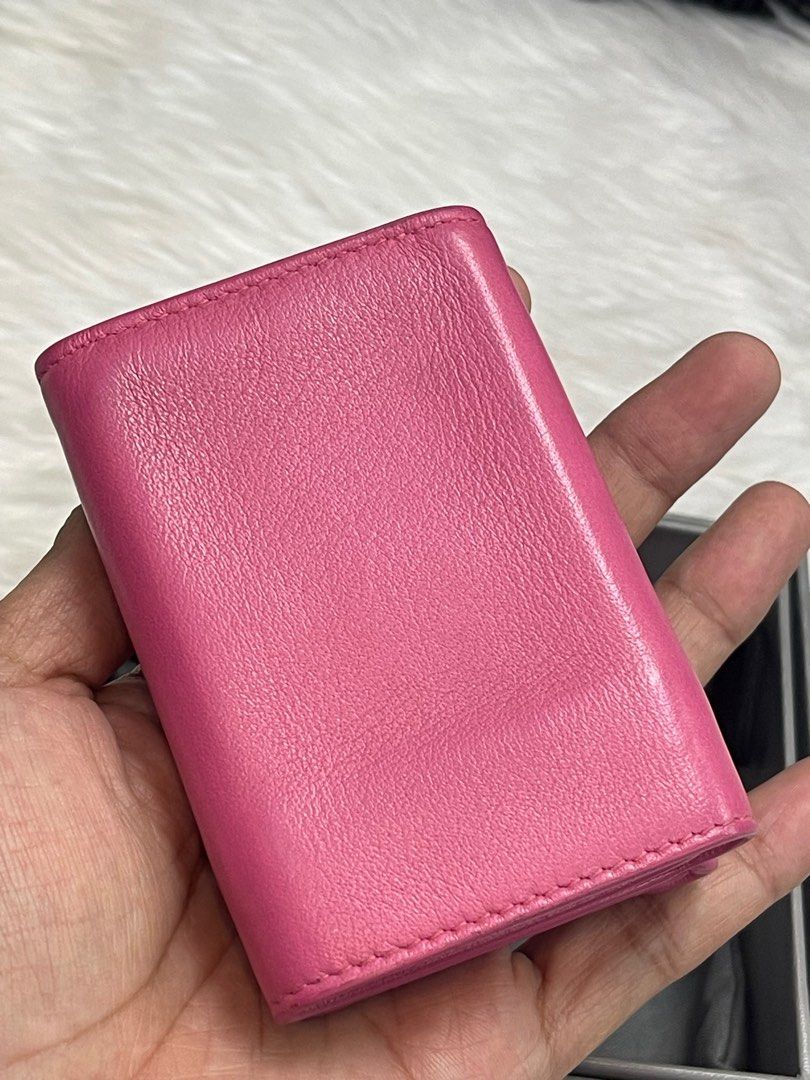 BALENCIAGA Papier Mini Pink Wallet (Category: Luxury Bags & Wallets) located in Taguig. Submitted by mluxeph (Listing ID 1385649232, Image 3). Description: BALENCIAGA Papier Mini Pink Wallet Gender: Ladies’ Material: Calfskin leather Stamp: 391446 5503 Y 2034 Interior: One snap closure coin pocket and one bill compartment Measurements: 3.75”L X 1.1”W X 2.5”H Handle Drop: None Hardware: Silver tone Inclusions: Original box, original dust bag and c