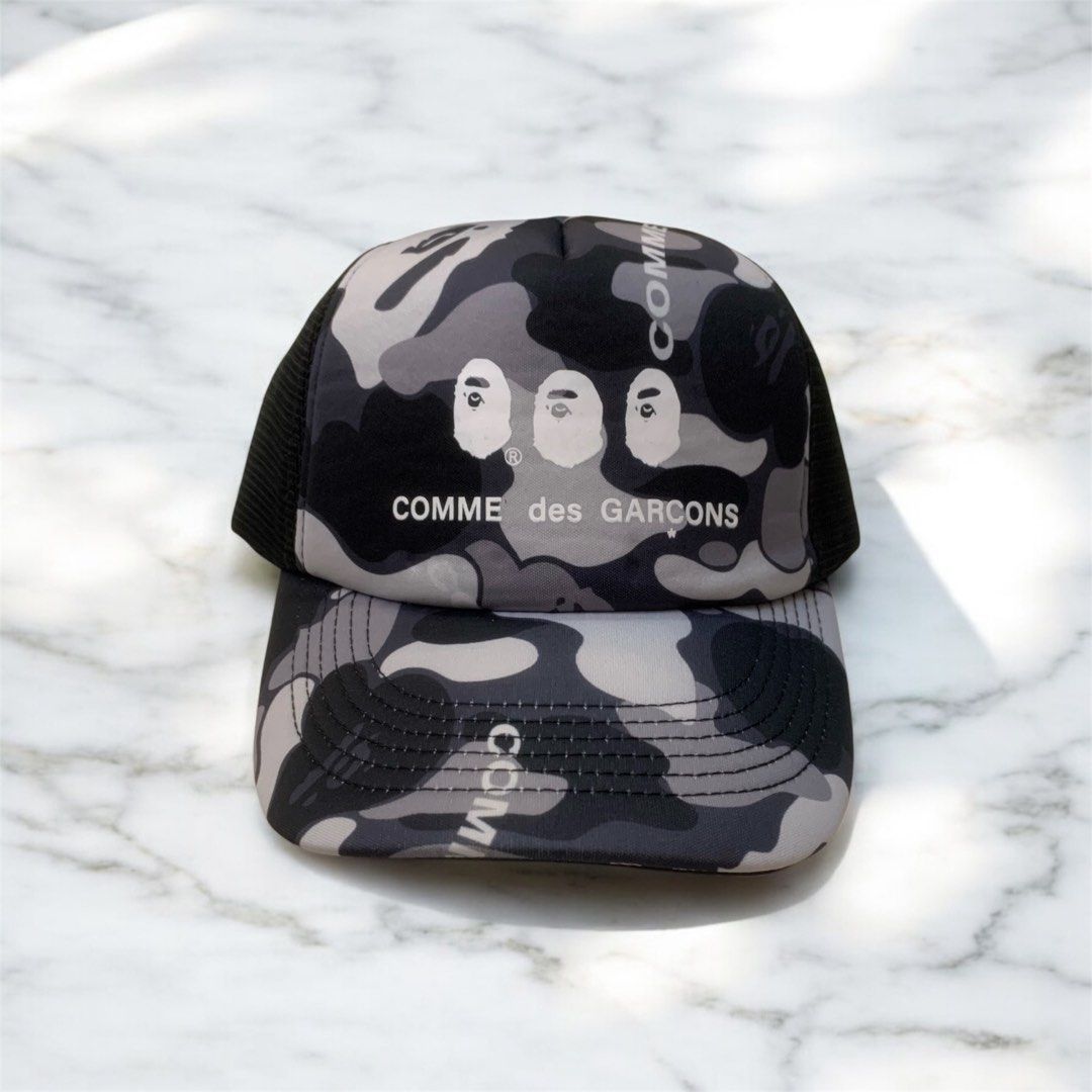 BAPE X CDG TRUCKER CAP (Category: Caps & Hats) located in Manila. Submitted by scarlett_hope (Listing ID 1385773917, Image 1). Description: BAPE X CDG TRUCKER CAP 1 SIZE FITS ALL COLOR RATE: 10/10 CONDITION: BRAND NEW MOP: GCASH COURIER: J&T.