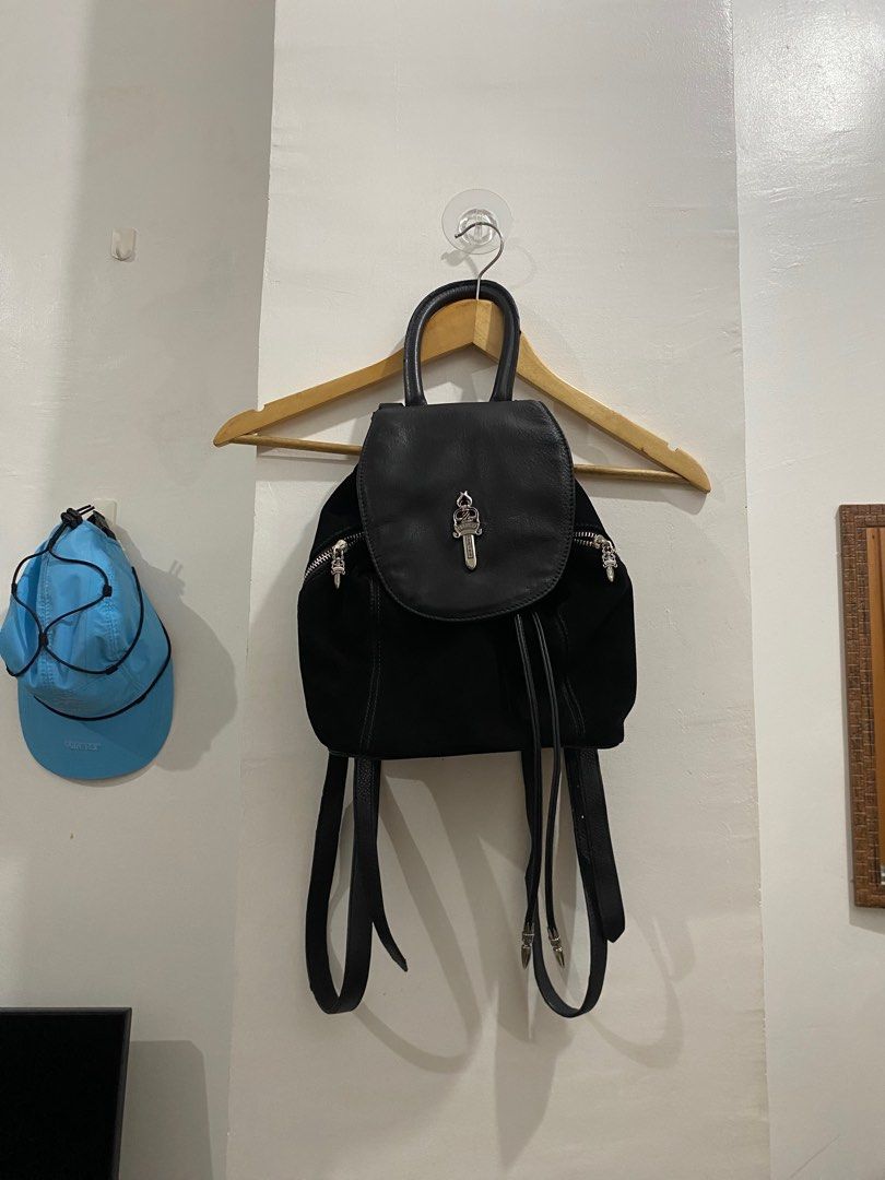 CHROME HEARTS IGGY LEATHER AND SUEDE BAGPACK (Category: Backpacks) located in Naga. Submitted by sislovesme (Listing ID 1385776580, Image 1). Description: •9/10 CONDITION •ISSUE RUBS AND SIGN OF USE CHECK PICS •Black Suede Leather Trim Rolled Handle & Dual Adjustable Shoulder Straps Logo Jacquard Lining & Dual Interior Pockets Drawstring Closure at Front •WIDTH 11 INCHES •HEIGHT 11.5 INCHES.