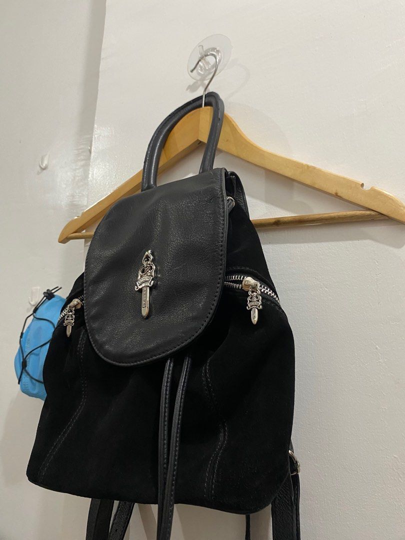 CHROME HEARTS IGGY LEATHER AND SUEDE BAGPACK (Category: Backpacks) located in Naga. Submitted by sislovesme (Listing ID 1385776580, Image 2). Description: •9/10 CONDITION •ISSUE RUBS AND SIGN OF USE CHECK PICS •Black Suede Leather Trim Rolled Handle & Dual Adjustable Shoulder Straps Logo Jacquard Lining & Dual Interior Pockets Drawstring Closure at Front •WIDTH 11 INCHES •HEIGHT 11.5 INCHES.