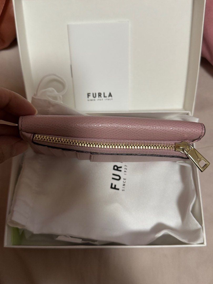 Furla Card Wallet Pink (Category: Luxury Bags & Wallets) located in Quezon City. Submitted by kmaeb (Listing ID 1385794476, Image 3). Description: Barely used Complete with box, dustbag and tags Can fit up to 5 cards 2 main compartment (flap and zipper) - can fit other cards and cash SF shouldered by buyer.
