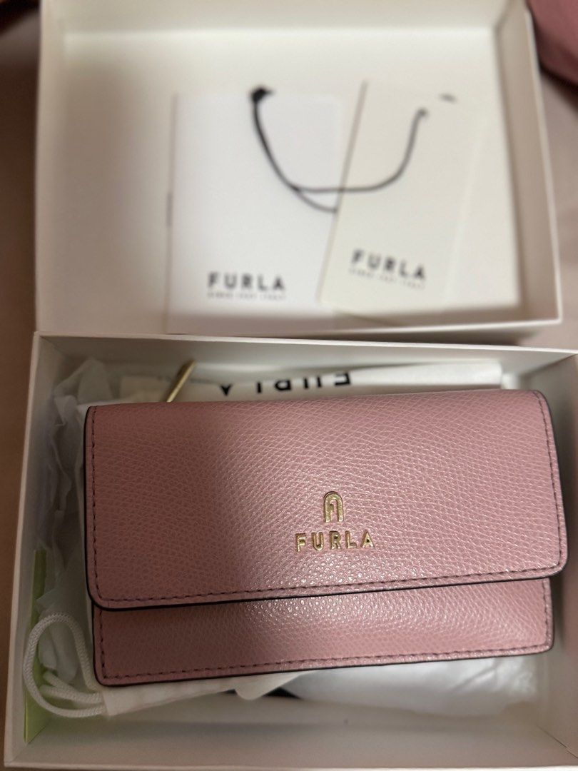 Furla Card Wallet Pink (Category: Luxury Bags & Wallets) located in Quezon City. Submitted by kmaeb (Listing ID 1385794476, Image 1). Description: Barely used Complete with box, dustbag and tags Can fit up to 5 cards 2 main compartment (flap and zipper) - can fit other cards and cash SF shouldered by buyer.