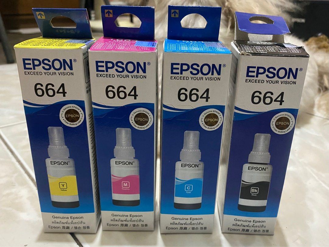genuine epson 664 ink set (Category: Printers, Scanners & Copiers) located in Los Banos. Submitted by oddklay (Listing ID 1385785644, Image 1). Description: genuine epson 664 ink set (see second pic for printer compatibility) rfs: di compatible sa printer namin. nabuksan lang yung black ink para itry pero wala pang bawas bought this online for 560 pesos.
