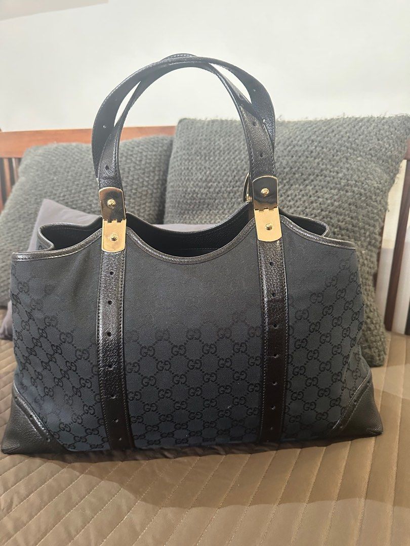 Gucci Horsebit Canvass Tote (layaway ok) (Category: Luxury Bags & Wallets) located in Muntinlupa City. Submitted by onemanila (Listing ID 1385642877, Image 1). Description: Nice bag for everyday and for office. It fits and 13” macbook plus all your essentials and still look slim. The handle comes with movable metal hardware so the leather handle will not crease. Inside is clean. Light scratch at the bottom of the bag. Size is 18”x 22”x4.5”.