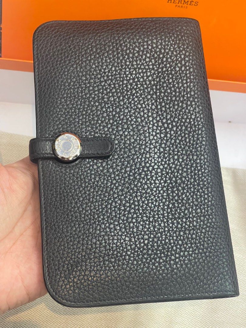 HERMES Dogon Noir Leather Duo Wallet (Category: Luxury Bags & Wallets) located in Taguig. Submitted by mluxeph (Listing ID 1385664568, Image 2). Description: HERMES Dogon Noir Leather Duo Wallet Gender: Ladies’ Material: Togo calfskin leather Stamp: Square Q Year: 2013 Interior: Five small flat pockets, two larger pockets, one removable zip pouch with two flat pockets Measurements: 7.75”L X 1”W X 5”H Handle Drop: None Hardware: Palladium Inclusio