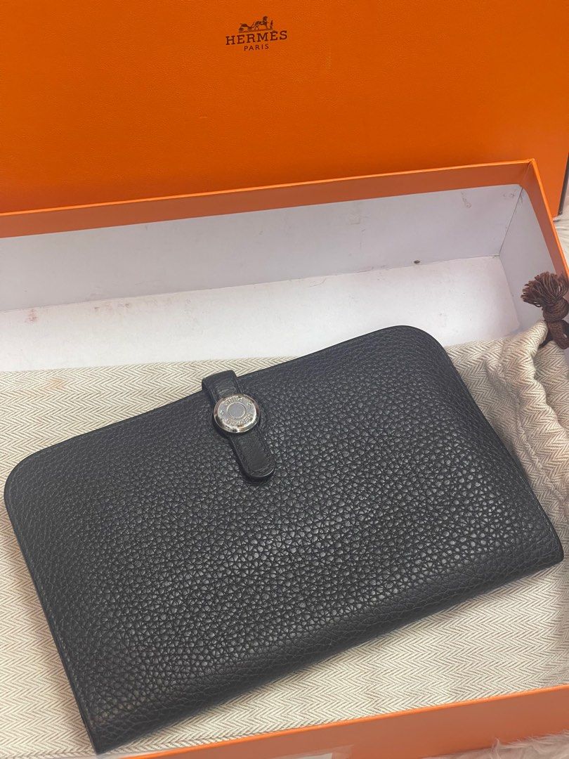 HERMES Dogon Noir Leather Duo Wallet (Category: Luxury Bags & Wallets) located in Taguig. Submitted by mluxeph (Listing ID 1385664568, Image 1). Description: HERMES Dogon Noir Leather Duo Wallet Gender: Ladies’ Material: Togo calfskin leather Stamp: Square Q Year: 2013 Interior: Five small flat pockets, two larger pockets, one removable zip pouch with two flat pockets Measurements: 7.75”L X 1”W X 5”H Handle Drop: None Hardware: Palladium Inclusio