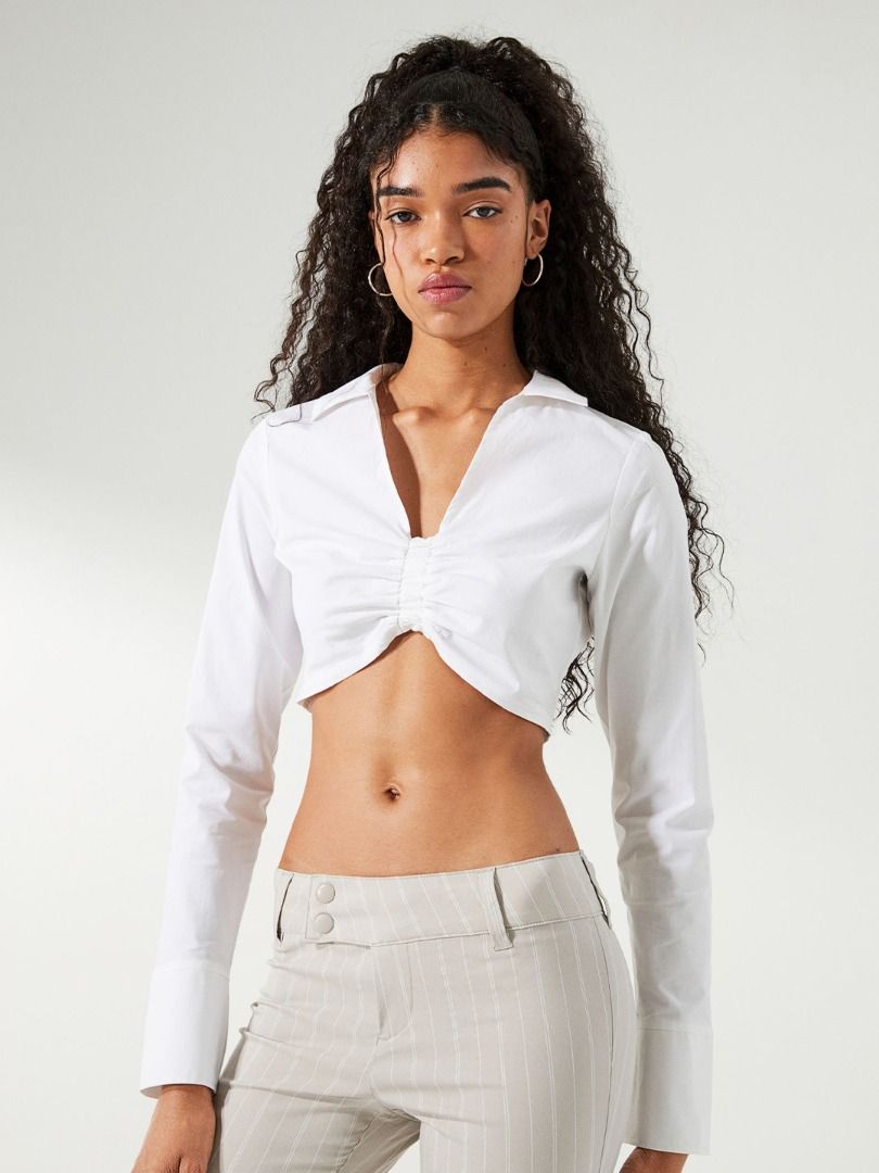 H&M White Long Sleeve Gathered Top (Category: Longsleeves) located in Marikina City. Submitted by planetgrapes (Listing ID 1385712224, Image 2). Description: - barely used - has yellow stains due to storage but can be washed out by bleach.