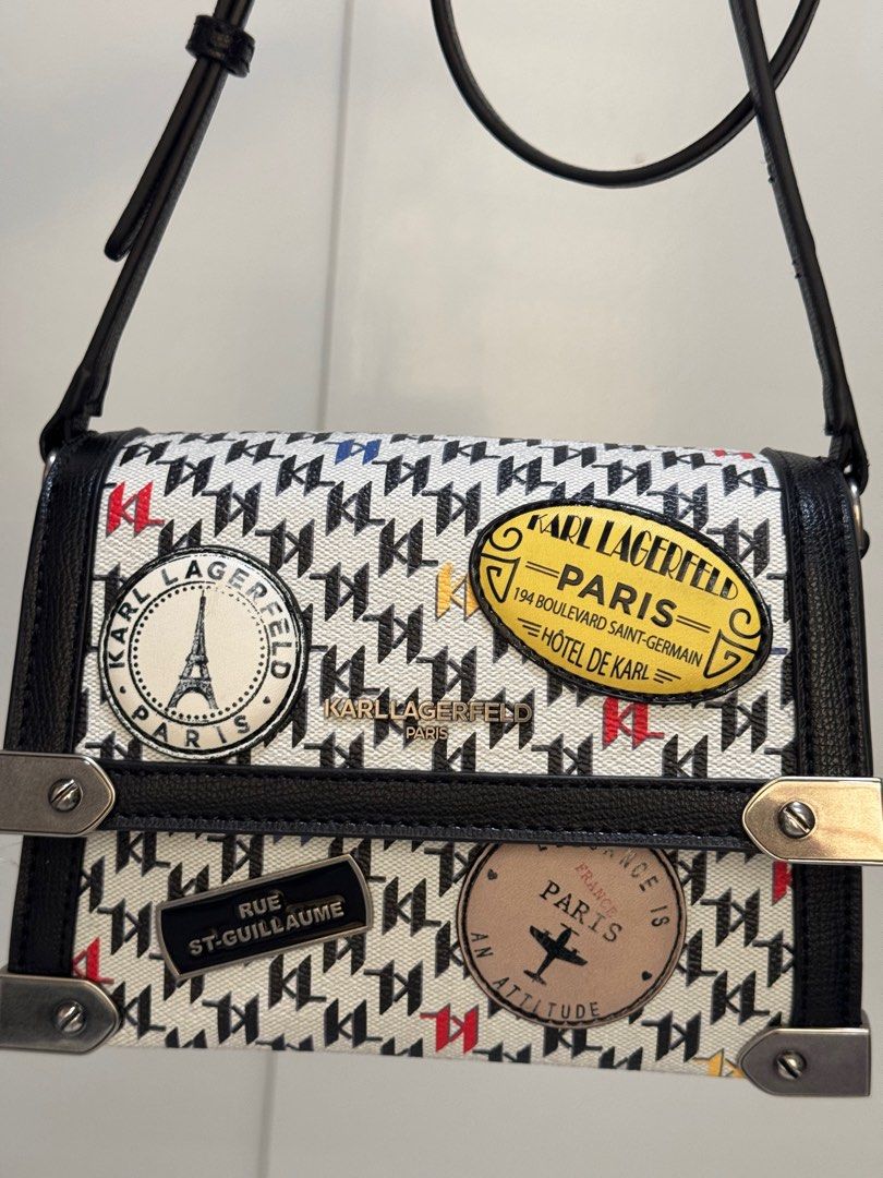Karl Lagerfeld Paris (Category: Shoulder Bags) located in San Mateo. Submitted by summerph (Listing ID 1385649357, Image 2). Description: Marselle crossbody by KARL LAGERFELD PARIS Product Features • Small sized bag; 8”W x 6” H x 4” D (width is measured across the bottom of handbag • 44” L adjustable crossbody strap • Flap magnetic closure • Silver-tone exterior hardware, back slip pocket, front slip pocket; interior back slip pocket, 2 card slot