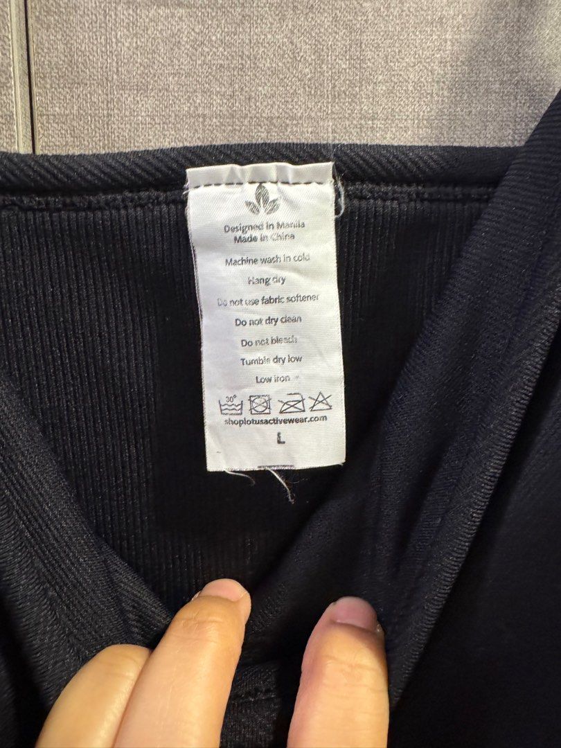 Lotus activewear ribbed bodycon (Category: Activewear) located in Taguig. Submitted by maybsv (Listing ID 1385711665, Image 2). Description: Never used too big sa akin. Natago lang sa cabinet. .