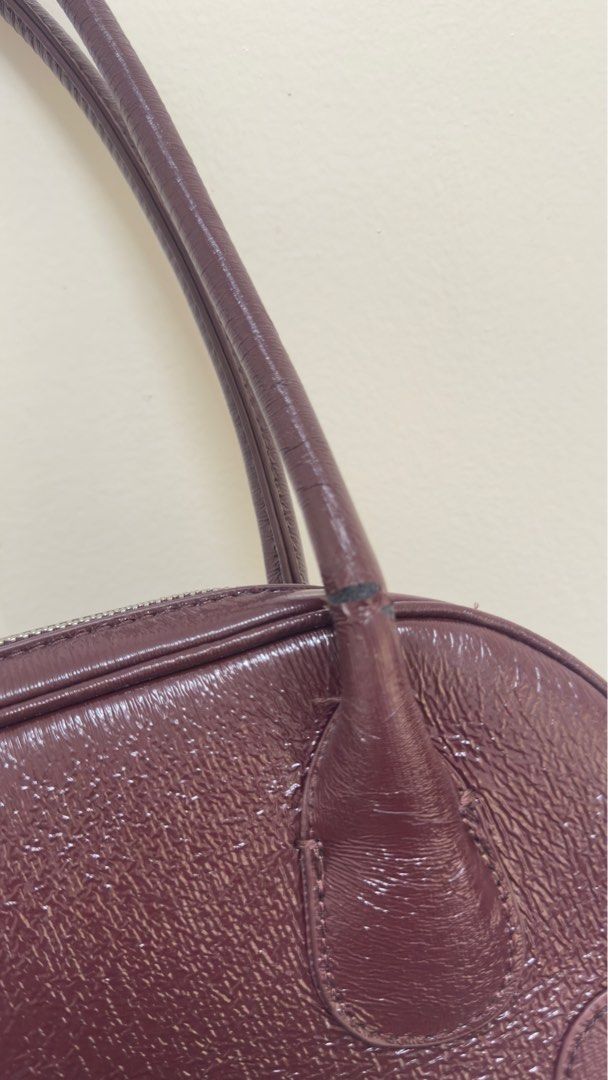 Parfois Maroon Bag (Category: Shoulder Bags) located in Marikina City. Submitted by decltqueen (Listing ID 1385690514, Image 3). Description: Parfois baguette bag Super cute and spacious - kahit maliit! May onting flaw (see pic) but overall good Light and commute friendly too. Bought for 1,800.