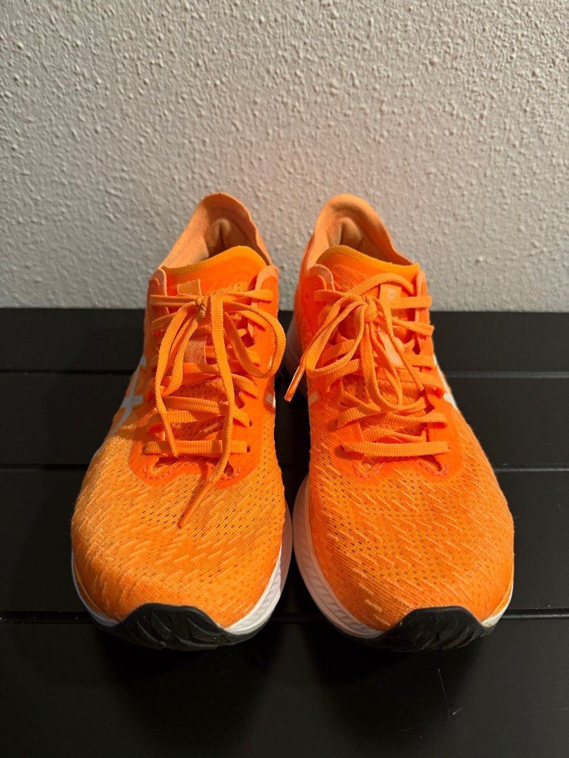 Asics Magic Speed Running Shoes - US 7.5 (24.5cm) (Category: Sneakers) located in Singapore. Submitted by fussfreedealwjamie (Listing ID 1390035730, Image 1). Description: Bought the wrong size for my daughter so selling. Only worn once, conditions of the shoes are as good as new. - Asics Magic Speed running shoes - Excellent condition - Bright orange color - US size 7.5 - Minimal wear on soles (see photos) - Suitable for running and casual wear.