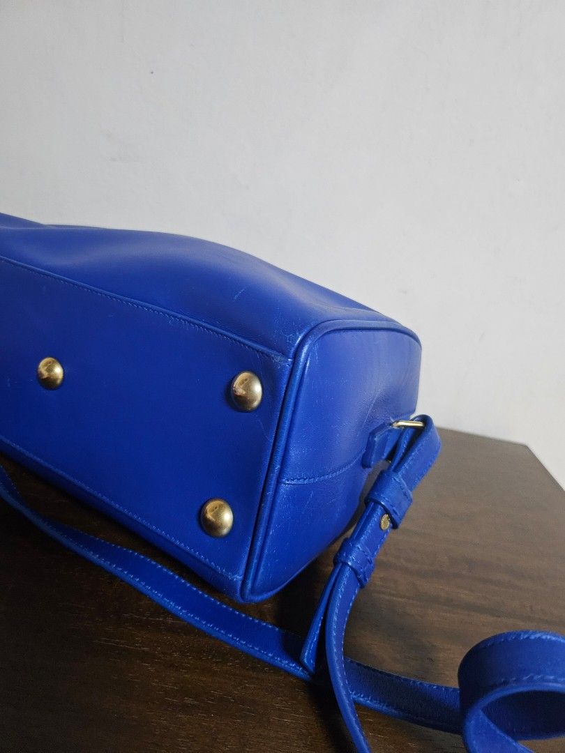 Mark Down! Authentic Saint Laurent Sac de Jour Nano Duffle (Category: Luxury Bags & Wallets) located in Las Pinas. Submitted by GGsCloset (Listing ID 1390163920, Image 3). Description: Authentic. Bag only. Saint Laurent Nano Duffle Bag in Electric Blue with gold hardware. Length: 9.4 in (24 cm) Height: 6.2 in (16 cm) Depth: 4.7 in (12 cm) Handle Drop: ~3 in (8 cm) Strap Drop: ~22 in (56 cm), adjustable/detachable.