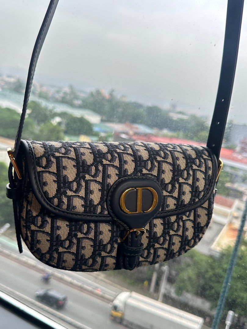 Dior Bobby East-West Bag (Category: Luxury Bags & Wallets) located in Taguig. Submitted by jthnl (Listing ID 1390117957, Image 3). Description: Dimensions: 21 x 12 x 5.1 cm / 8.5 x 4.5 x 2 inches (Length x Height x Width) Strap length: 90 – 110 cm / 35.5 – 43.5 inches Drop length: 41 – 51 cm / 16 – 20 inches Weight: 300 g / 10.5 ounces.